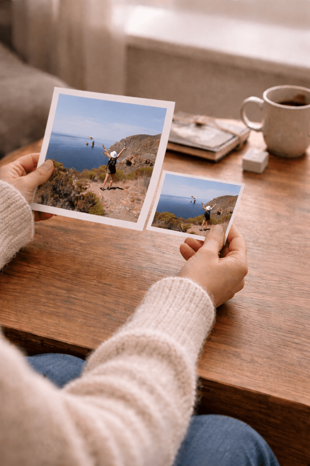 Hands holding printed photos